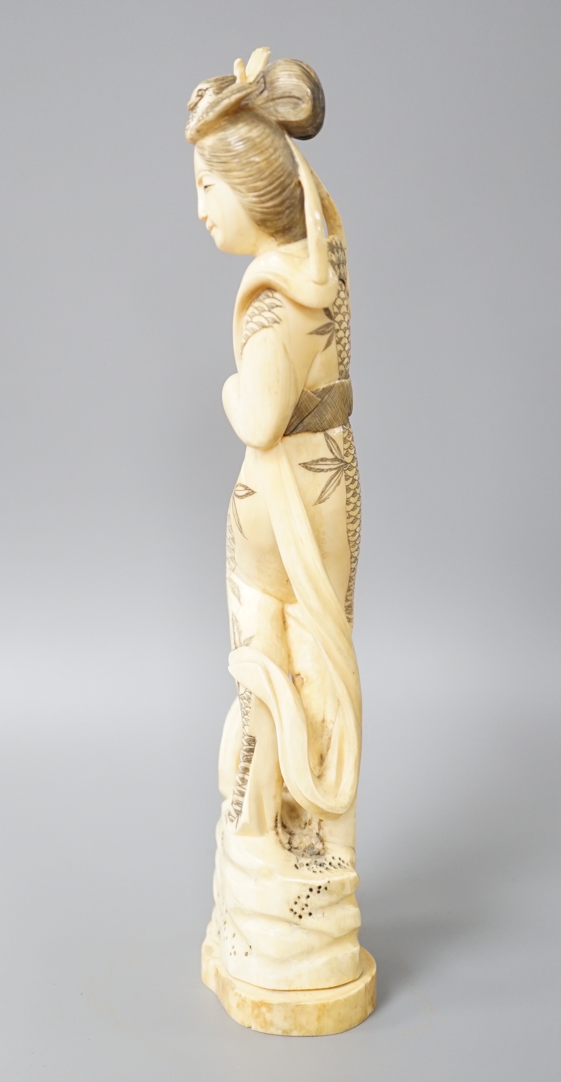 A Japanese walrus ivory figure of Seiobo, the Queen Mother of the West, early 20th century 28cm